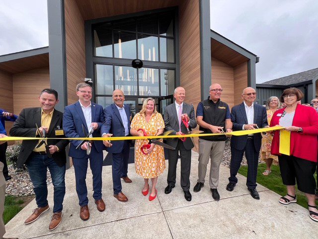 Community leaders cut the ribbon at the opening of the new Youth Service Bureau facility