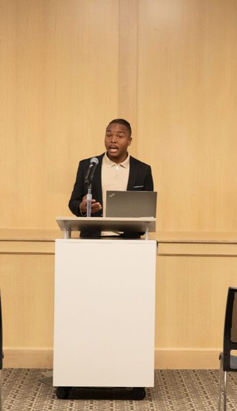 Jelani Cotton speaks at a donor event