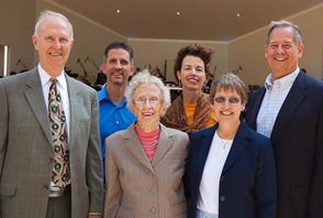 Smiling individuals celebrate the dedication of the Christ Wilson Pavilion