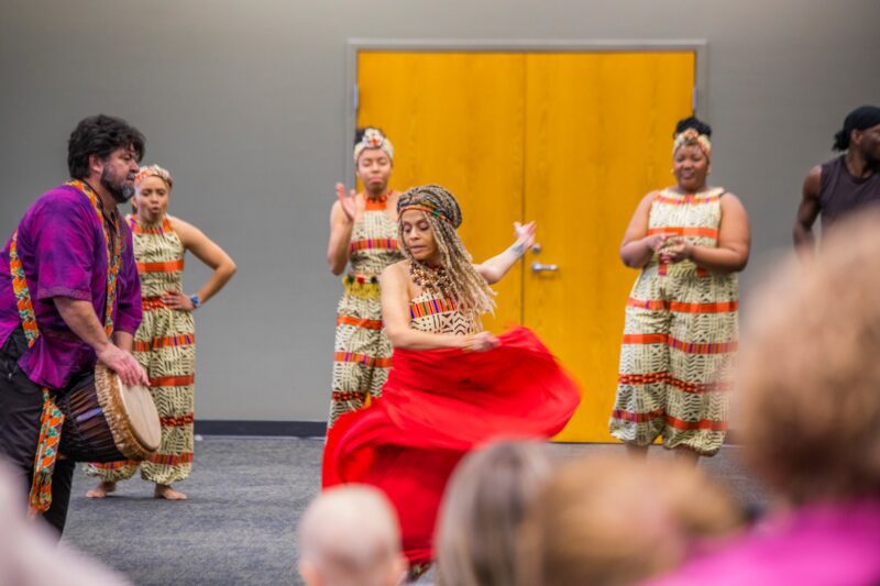 Founder Kelly Burgét dances with the troupe from UZIMA! African Drum and Dance. Burgét passed away on February 6.